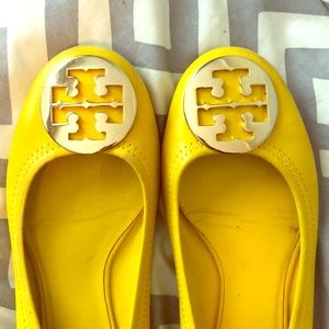 Yellow Tory Burch shoes.